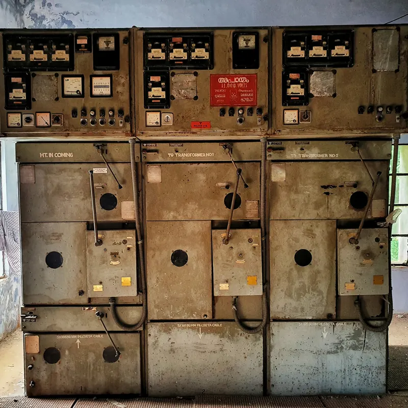 Row of older switchgear panels with meters and operating handles