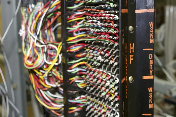 Dense multicolored control wiring landed on an older terminal frame