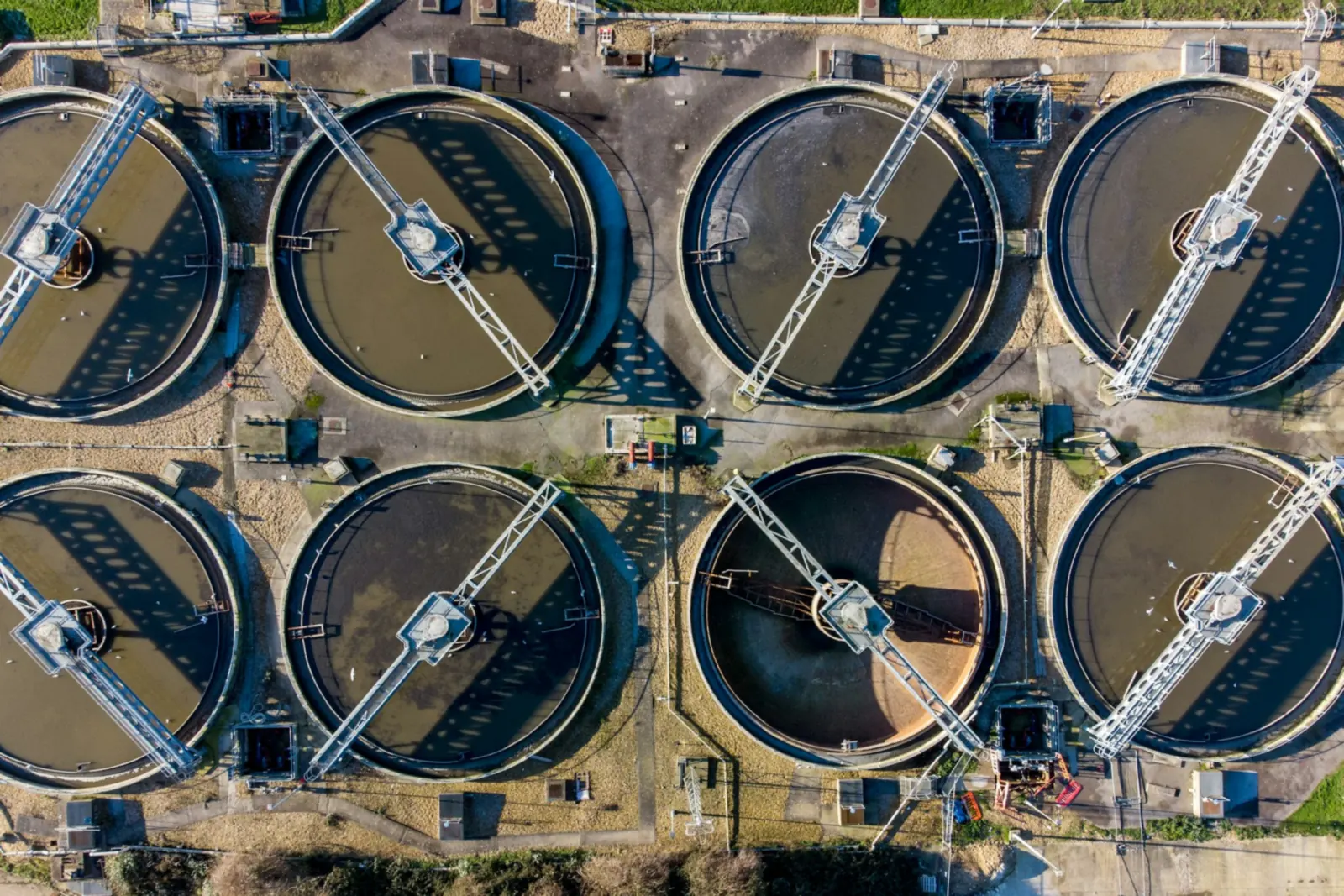 Aerial view of round clarifier basins at a water treatment plant