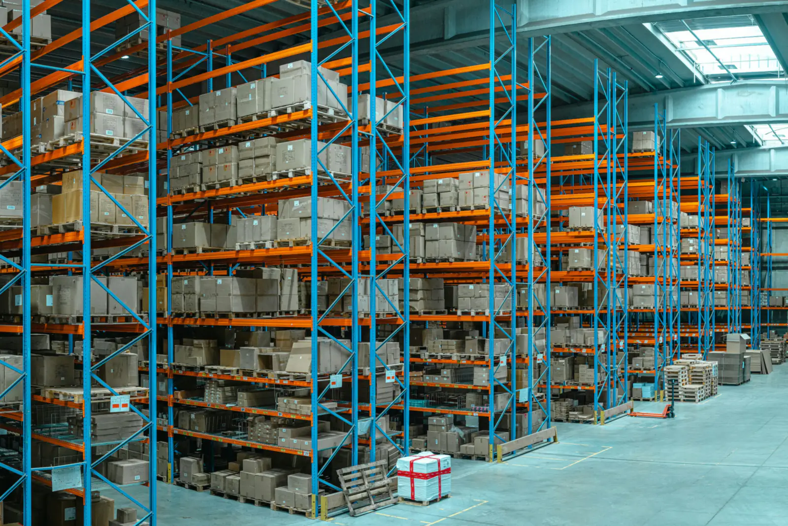Warehouse with tall pallet racking stocked with boxes