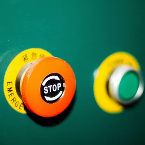 Emergency stop and green pushbuttons